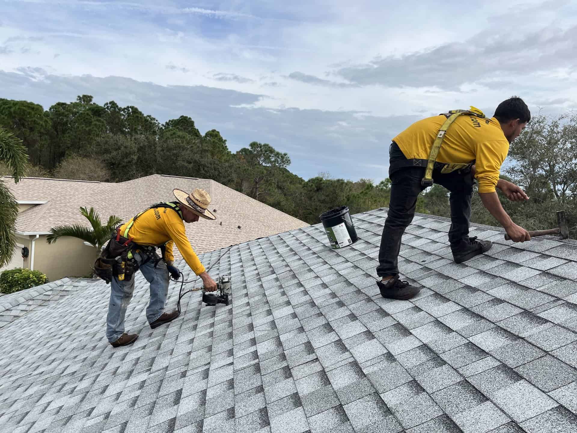 Roofing crew working on a home